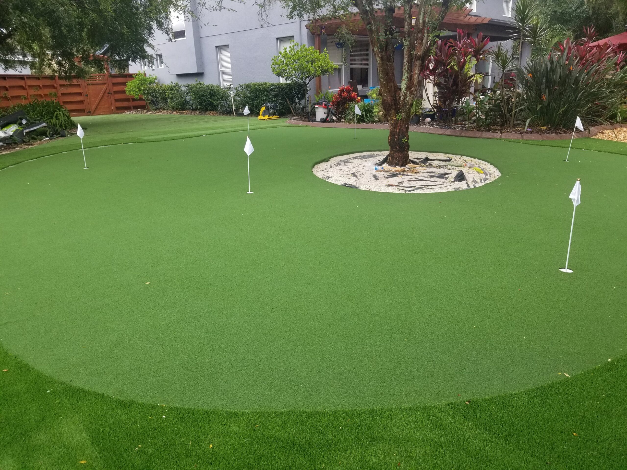 fake grass installation of golf putting green